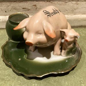 Early 20th century pig fairing match striker